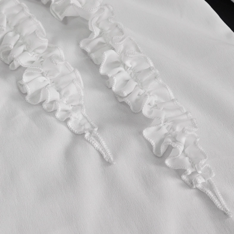 Delicate satin ruffled trim and lace edging detail on gothic white shirt fabric