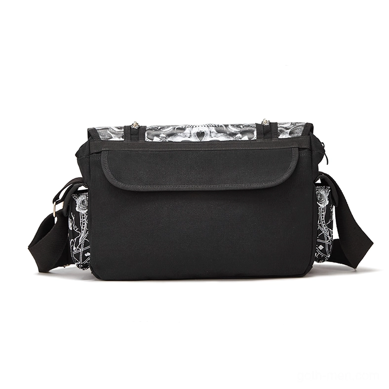 Gothic crossbody bag back view showing solid black flap pocket and printed side panels with skull motif
