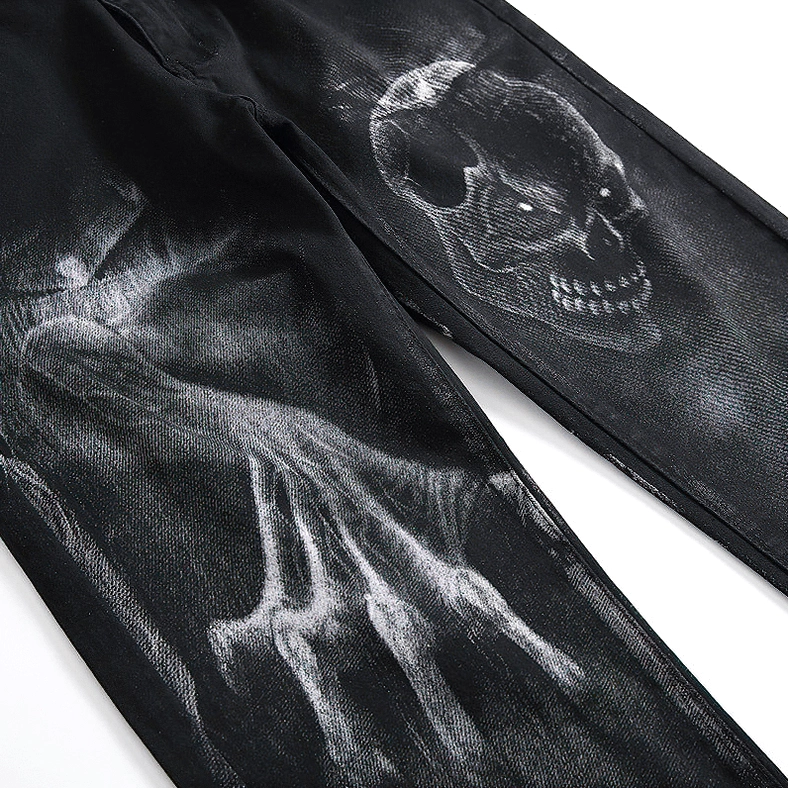 Close-up detail of black denim skull and ghost hand printed texture with 3D effect