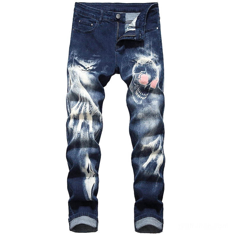 Navy blue distressed denim jeans with pink-eyed skull print and bleached faded design front view