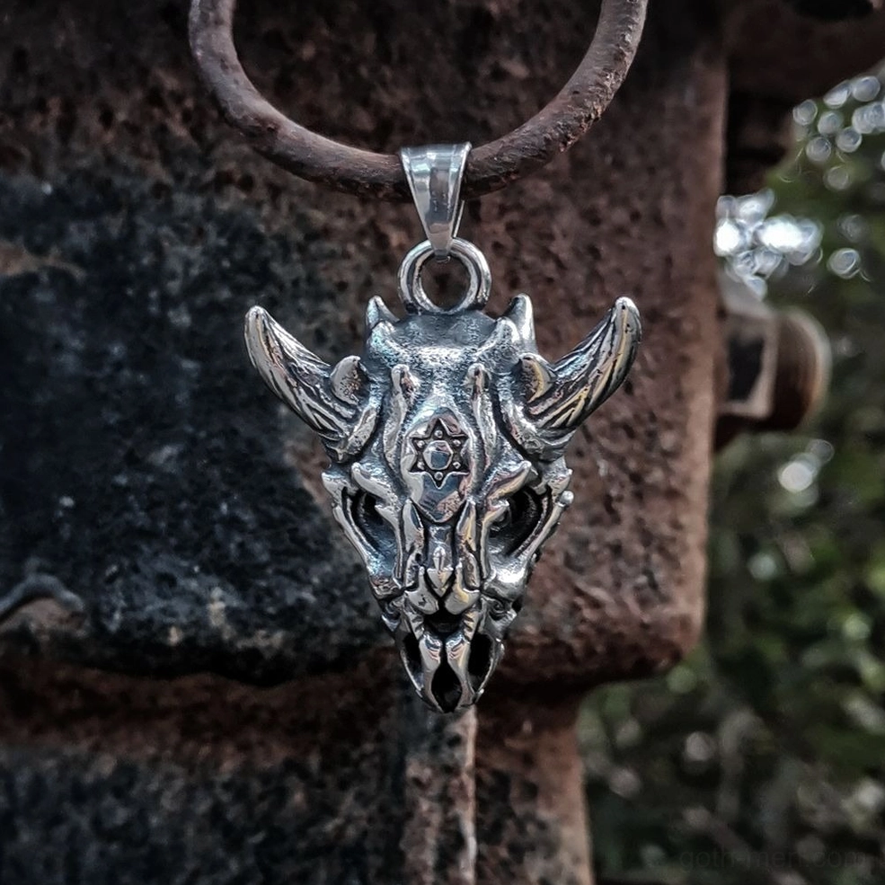 Horned demon skull pendant on leather rope industrial outdoor setting showcasing gothic subculture aesthetic