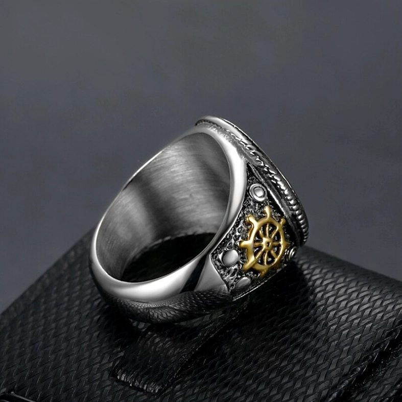 Gothic skull pirate ring inner band detail on leather jewelry case, brushed silver interior with ship wheel accent