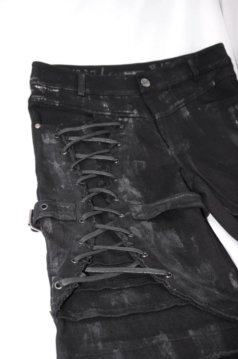Lower leg and ankle view of black gothic slim trousers with tapered opening and distressed detail