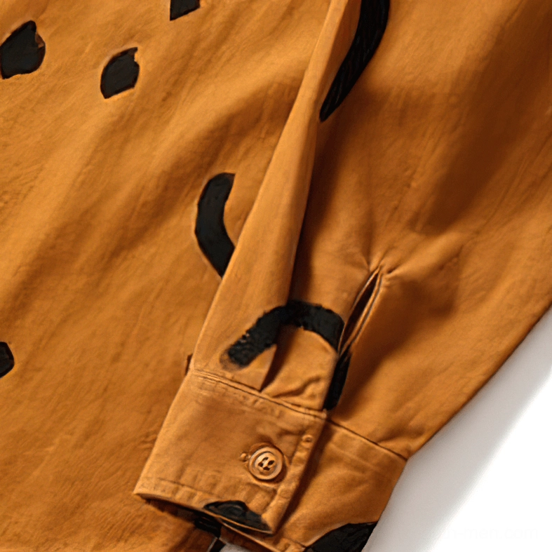 Black gothic smiley print shirt hem detail, white smile graphics, loose long sleeve cuff and construction