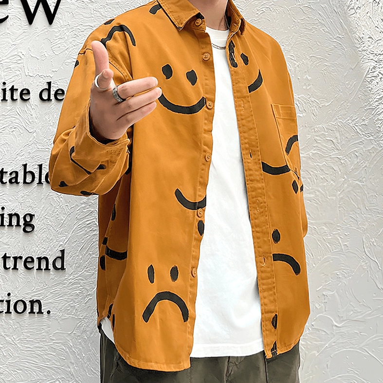 Burnt orange gothic smiley shirt detail, black hand-drawn smile motif close-up, print quality and fabric texture showcase