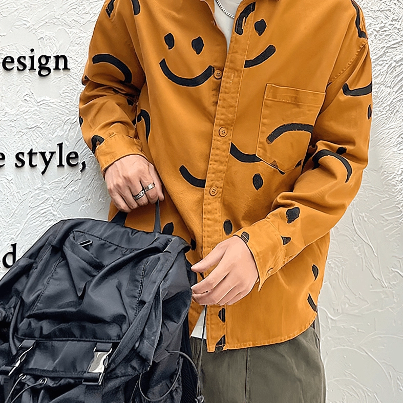 White gothic smiley print shirt sleeve detail, black smile graphics, full-length regular sleeve construction