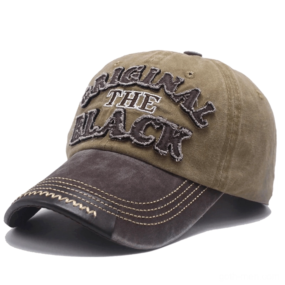 Washed gothic baseball cap with adjustable strap closure showing embroidered letter accent and vintage aesthetic