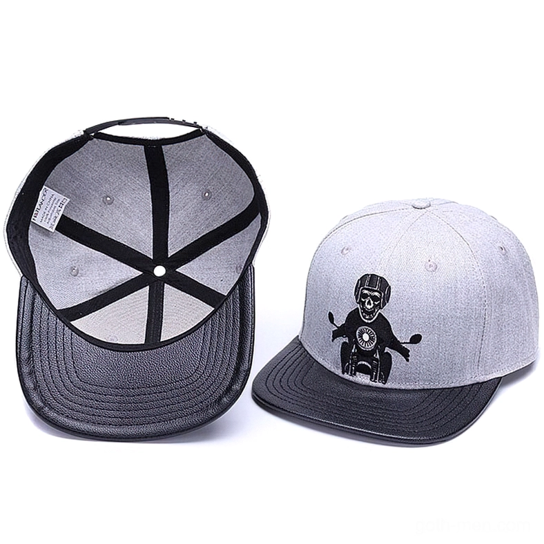 Interior lining and overhead views of gothic snapback showing cross-stitched crown padding and embroidery placement