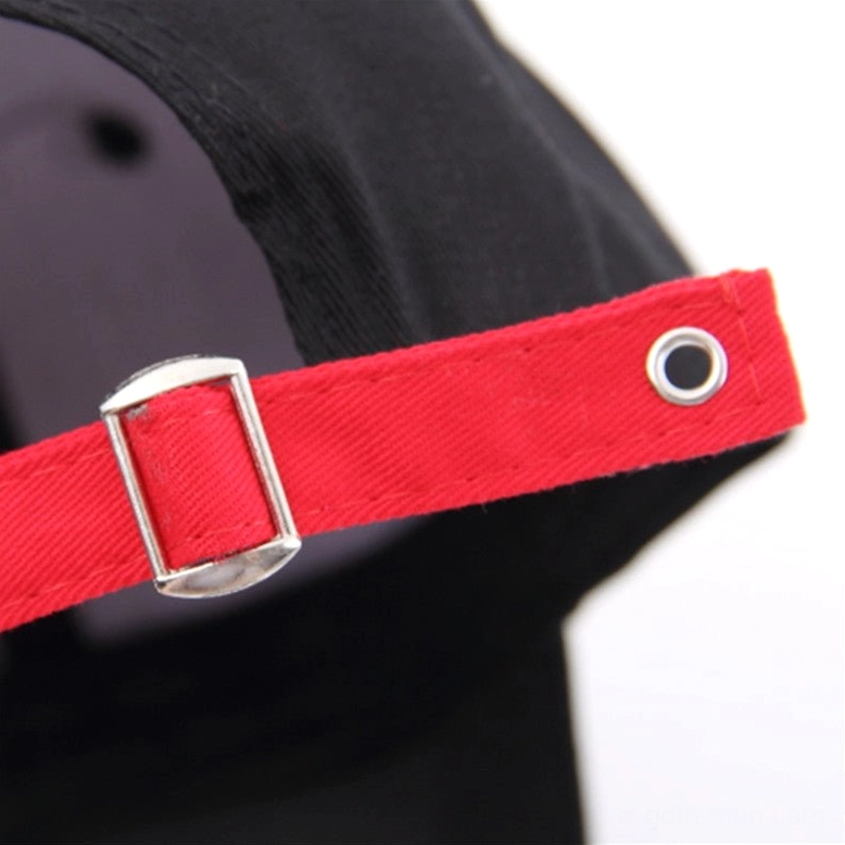 Red fabric adjustable snapback strap with silver metal buckle fastener on gothic graffiti baseball cap
