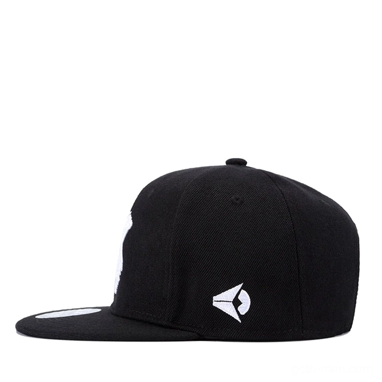 Black snapback baseball cap side profile view showing adjustable structure and emblem detail