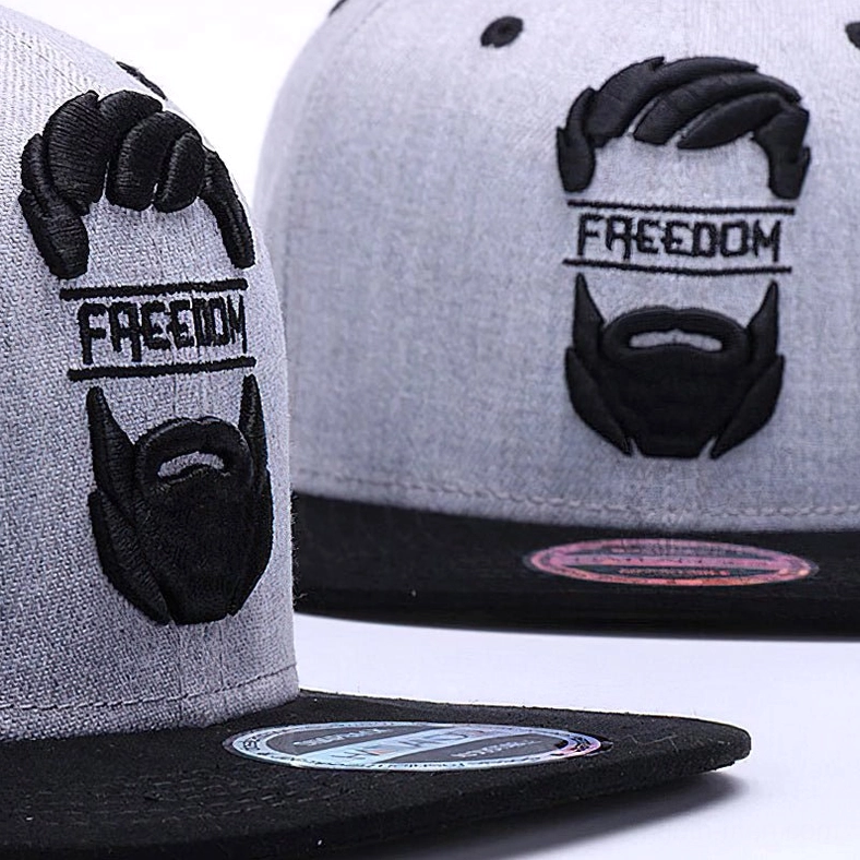 Close-up side view of gothic snapback cap showing embroidered mustache and beard design with woven fabric texture and brand sticker detail