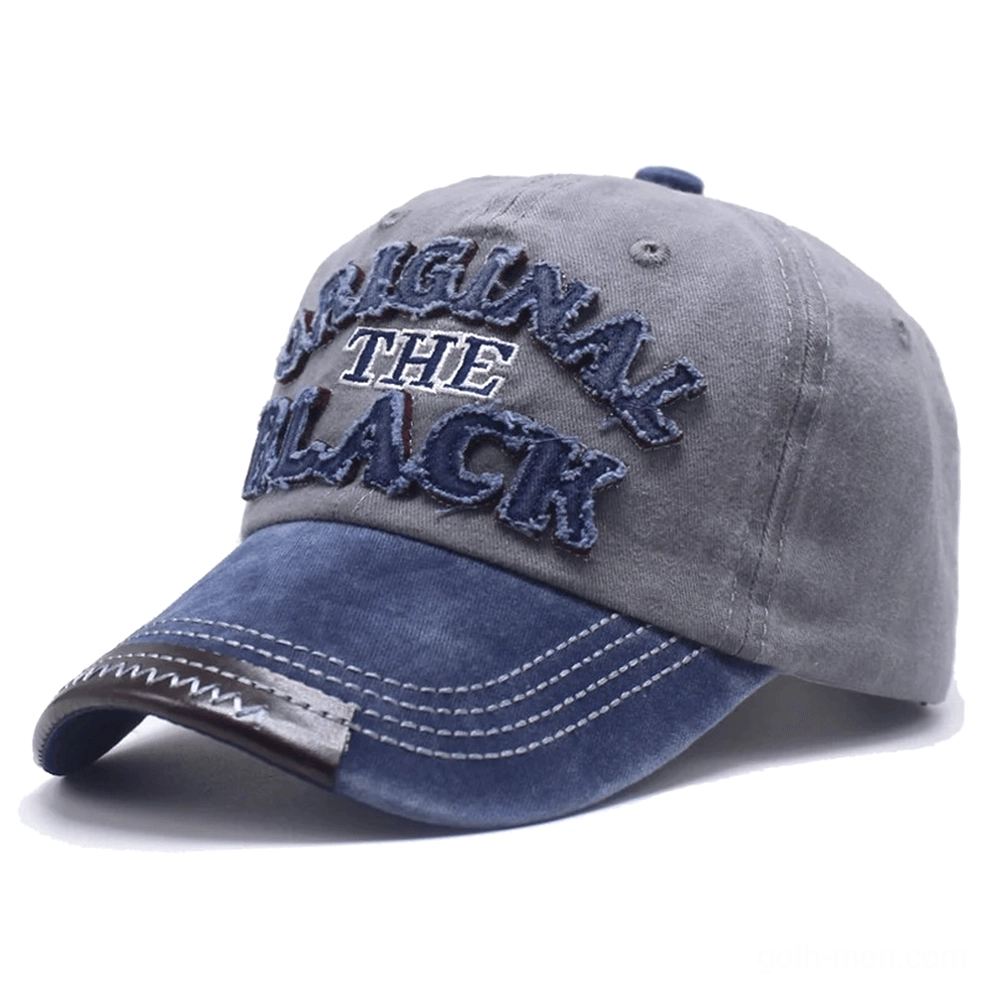 Light grey and blue washed gothic snapback cap with white contrast stitching and embroidered letter logo