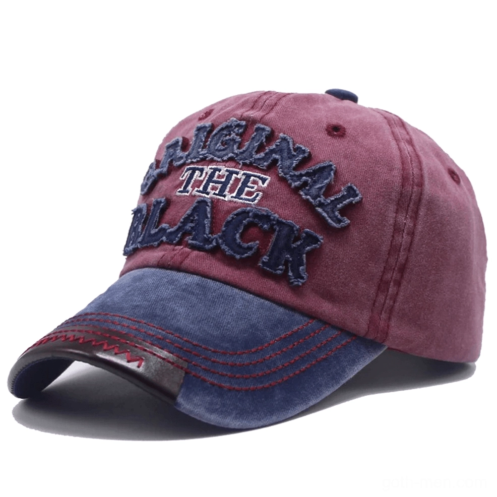 Navy blue washed gothic baseball cap with burgundy contrast brim, red contrast stitching, and embroidered letter accent
