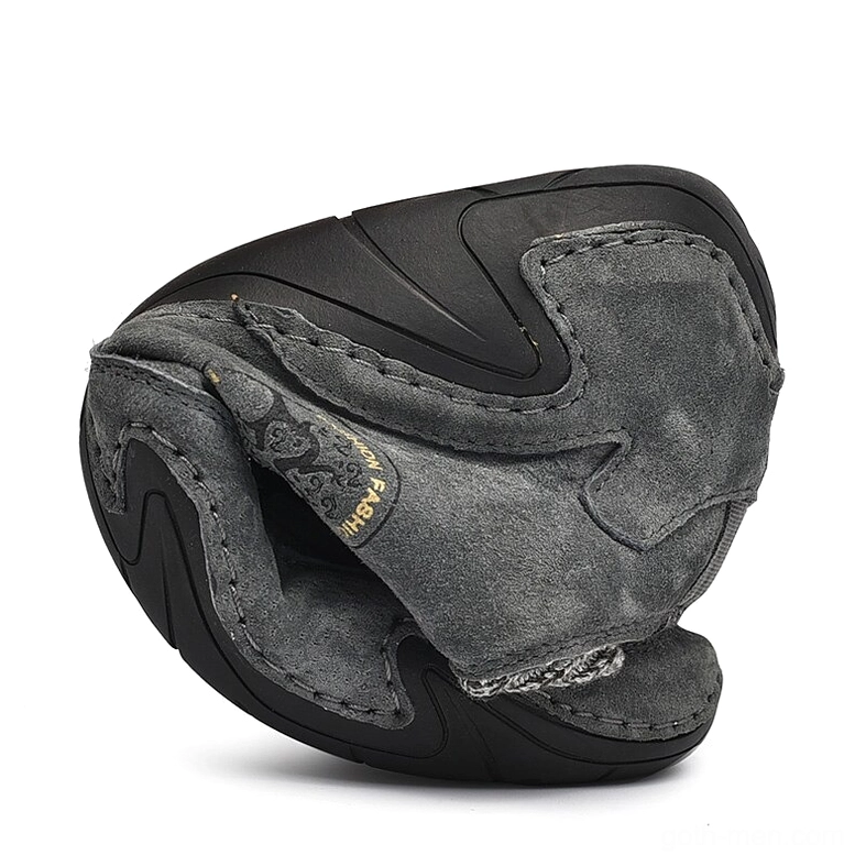 Folded dark grey gothic sneaker sample showing flexible split rubber sole and construction - overhead view