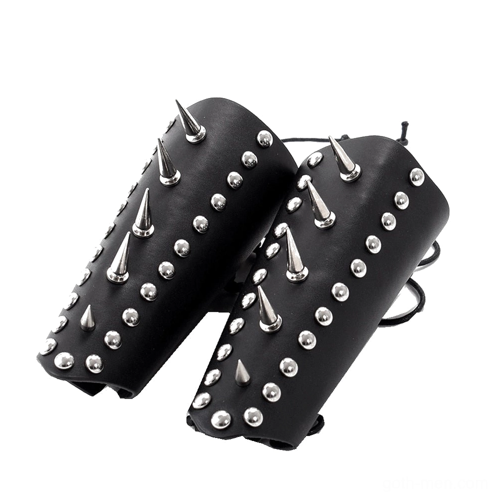Pair of matching black leather studded wrist guards with dual lace-up fasteners, flat lay top-down view showing symmetrical stud arrangement