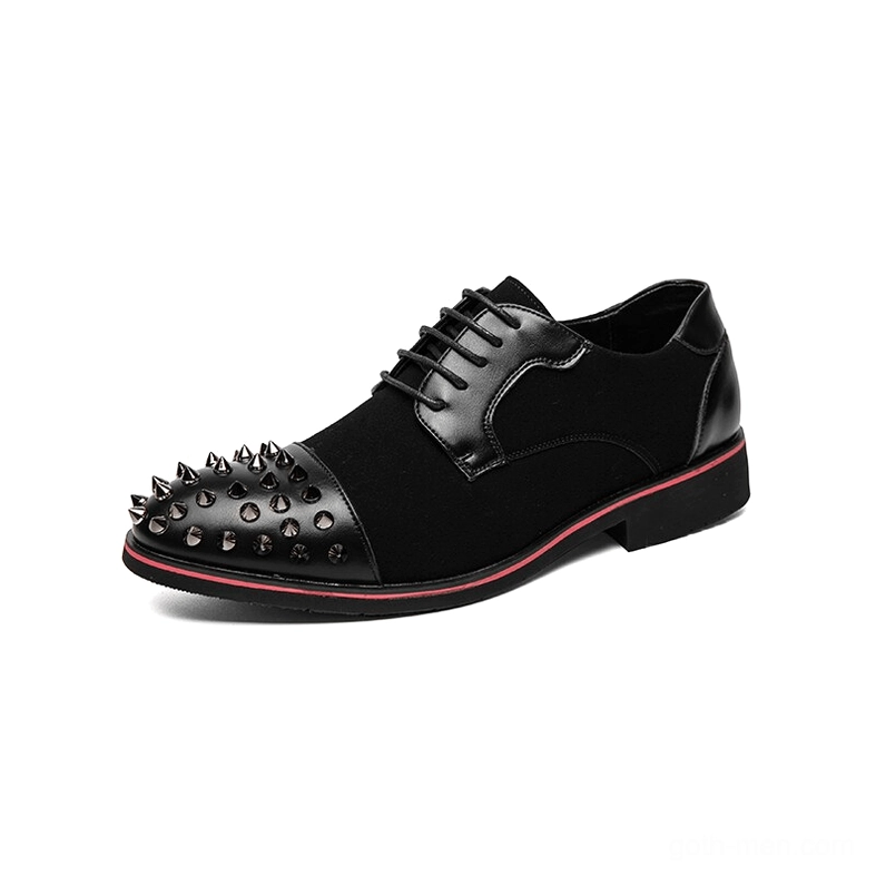 Three-quarter view of black spiked derby shoe with red outsole trim and spike decoration