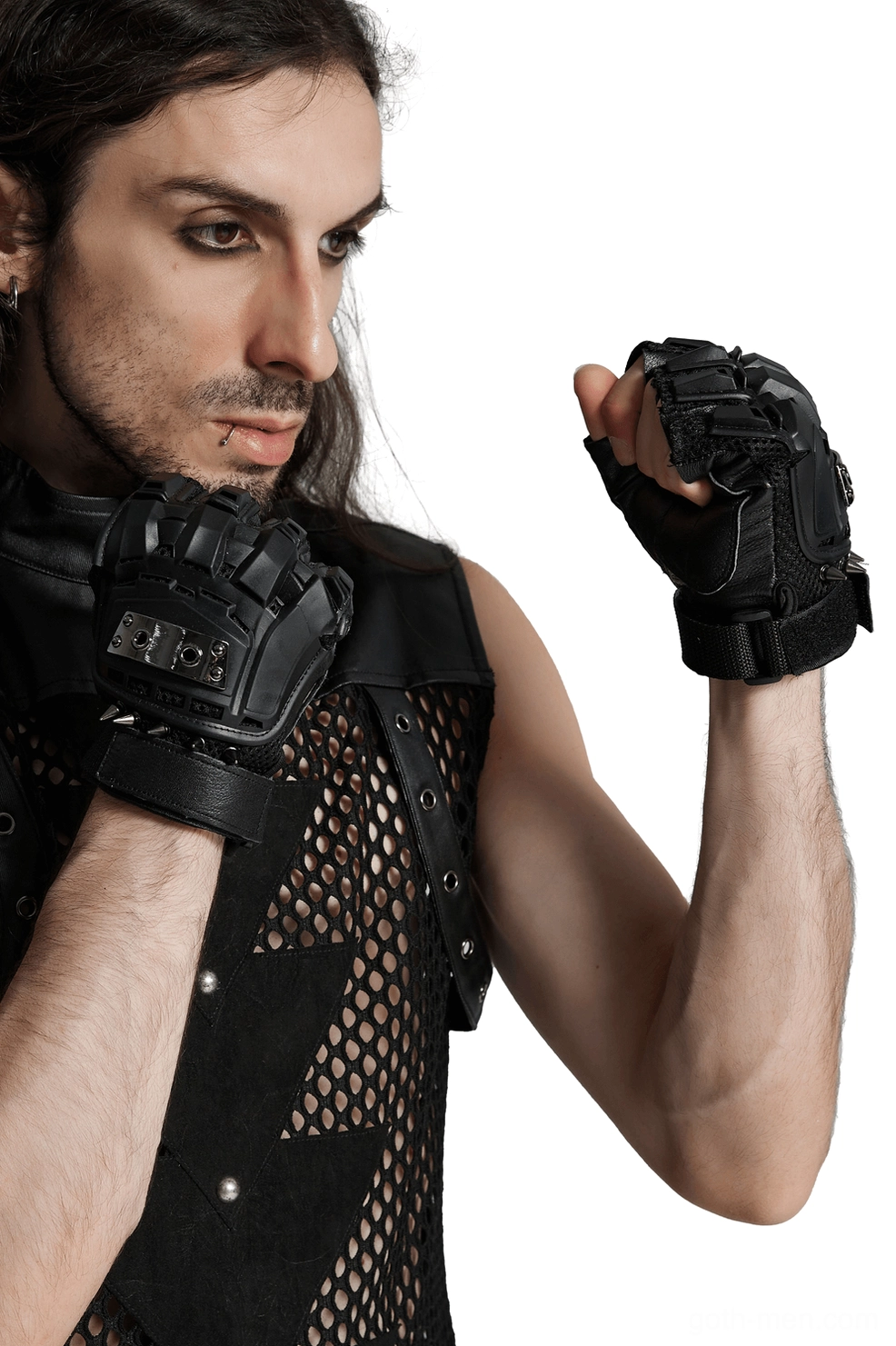 Male model wearing black gothic spiked fingerless gloves with hard shell armor protection, full body front view
