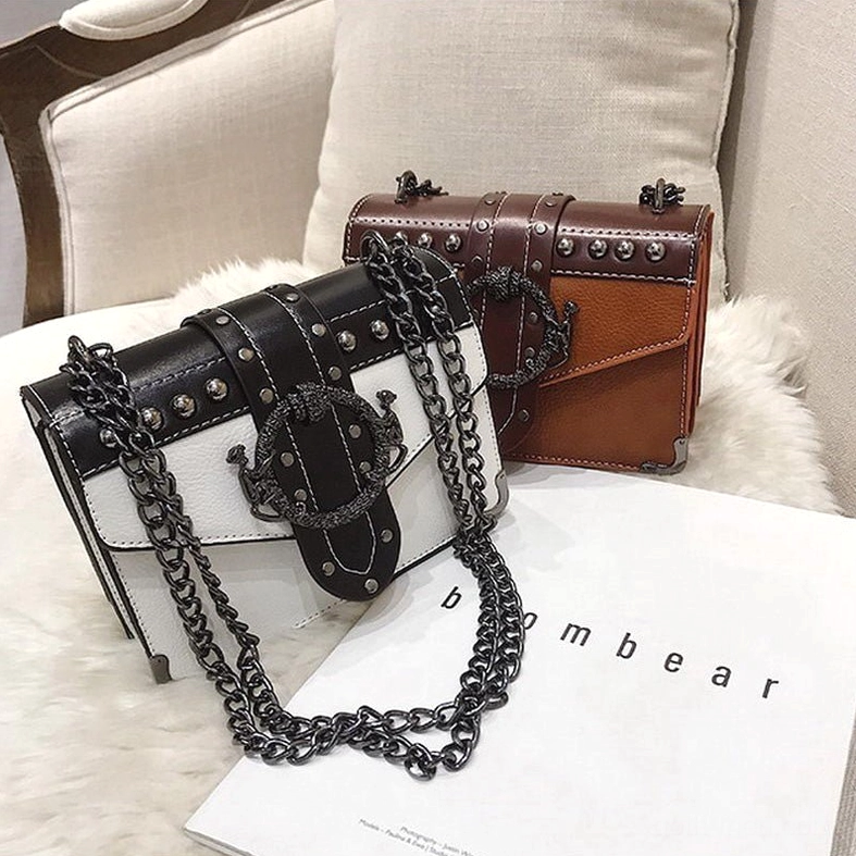 Black white and tan gothic square shoulder bags displayed on fur showing versatile colorway options