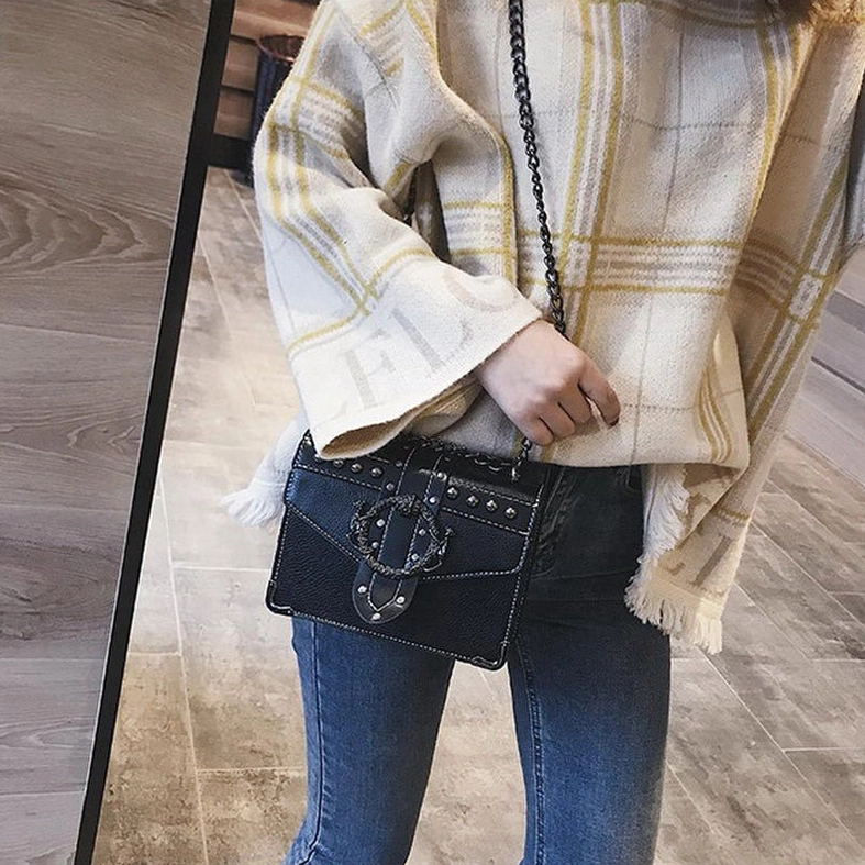 Gothic square shoulder bag PU leather close-up showing ornate metal lock and rivet texture details