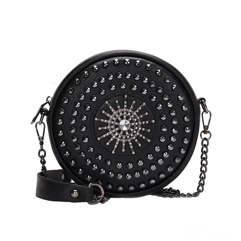 Black gothic studded circular crossbody bag with sunburst rivet pattern and rhinestone decoration, front flat lay view