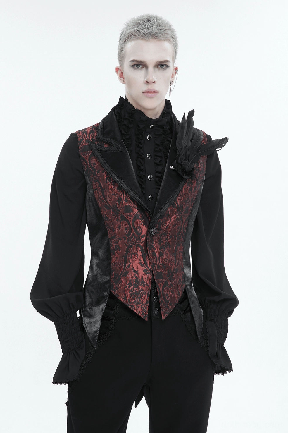 Male model wearing wine-red gothic swallowtail waistcoat, hands in pockets, frontal pose