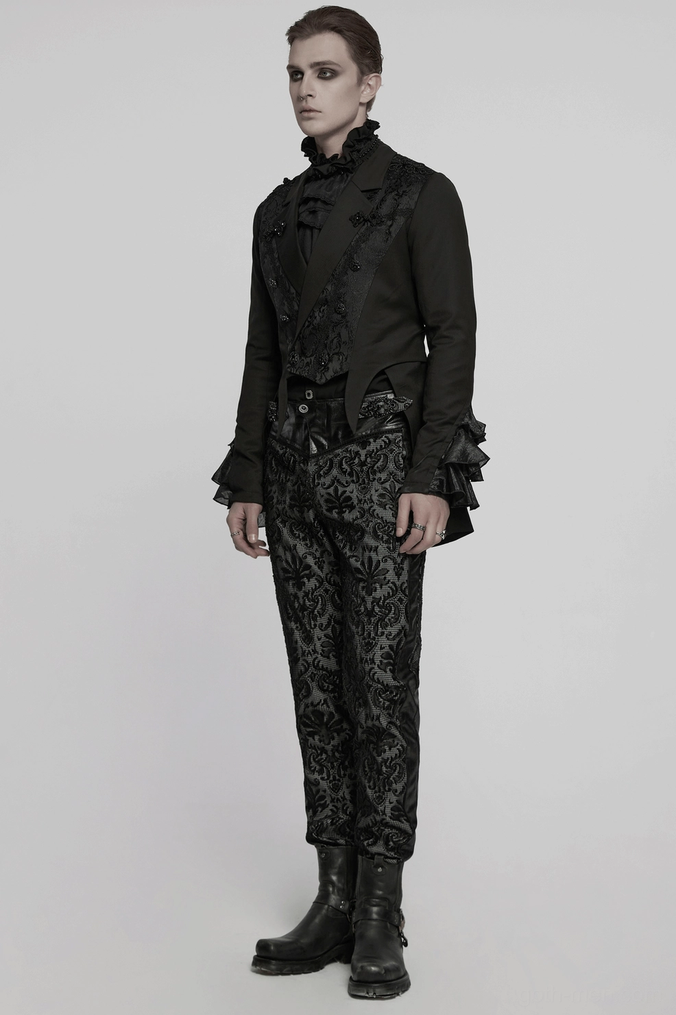 Gothic Victorian men's tailcoat jacket shown in formal styling with peaked lapels, jacquard embroidery, and ornamental button closures