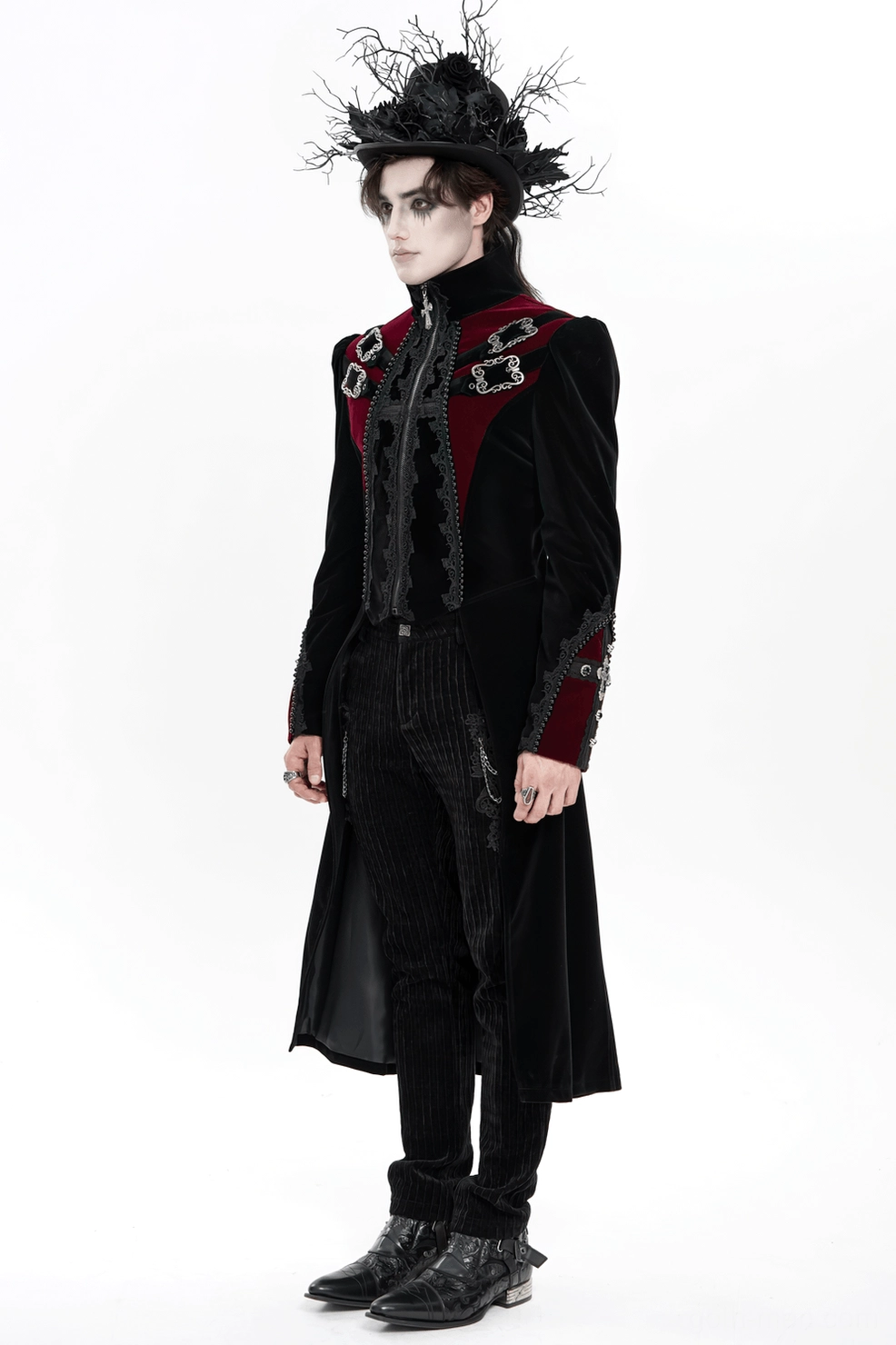 Front 3/4 view of gothic velvet tailcoat on male model displaying cross zipper and lace embroidery detailing