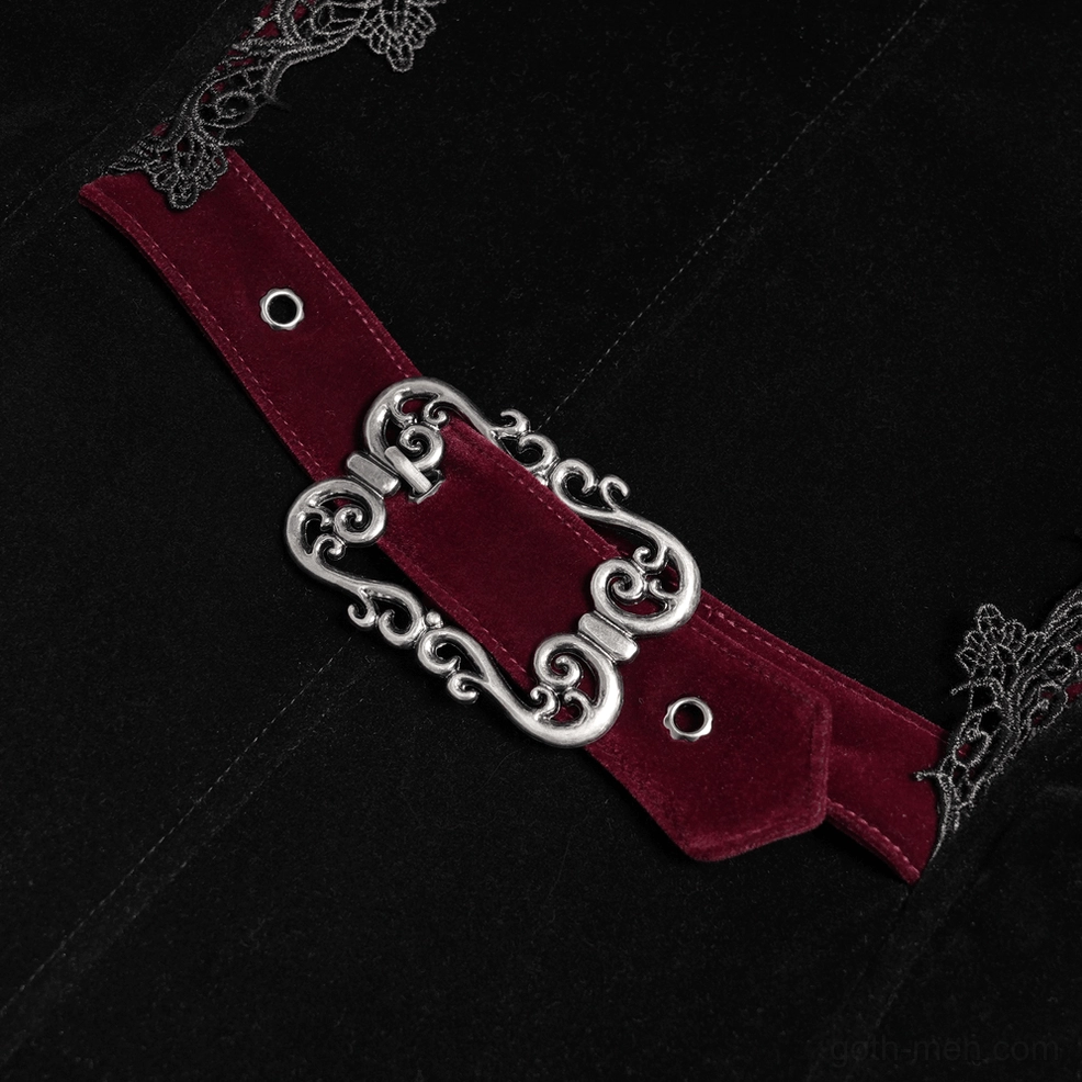 Full-body view of gothic tailcoat styled on mannequin with dramatic long train and structured victorian silhouette