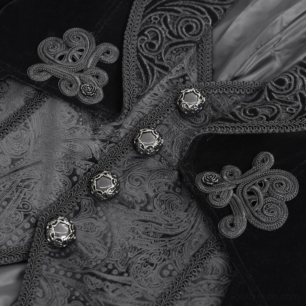 Ornate metal button and jacquard patterned interior lining detail of Gothic tailcoat, showing decorative fastening and scroll embroidery