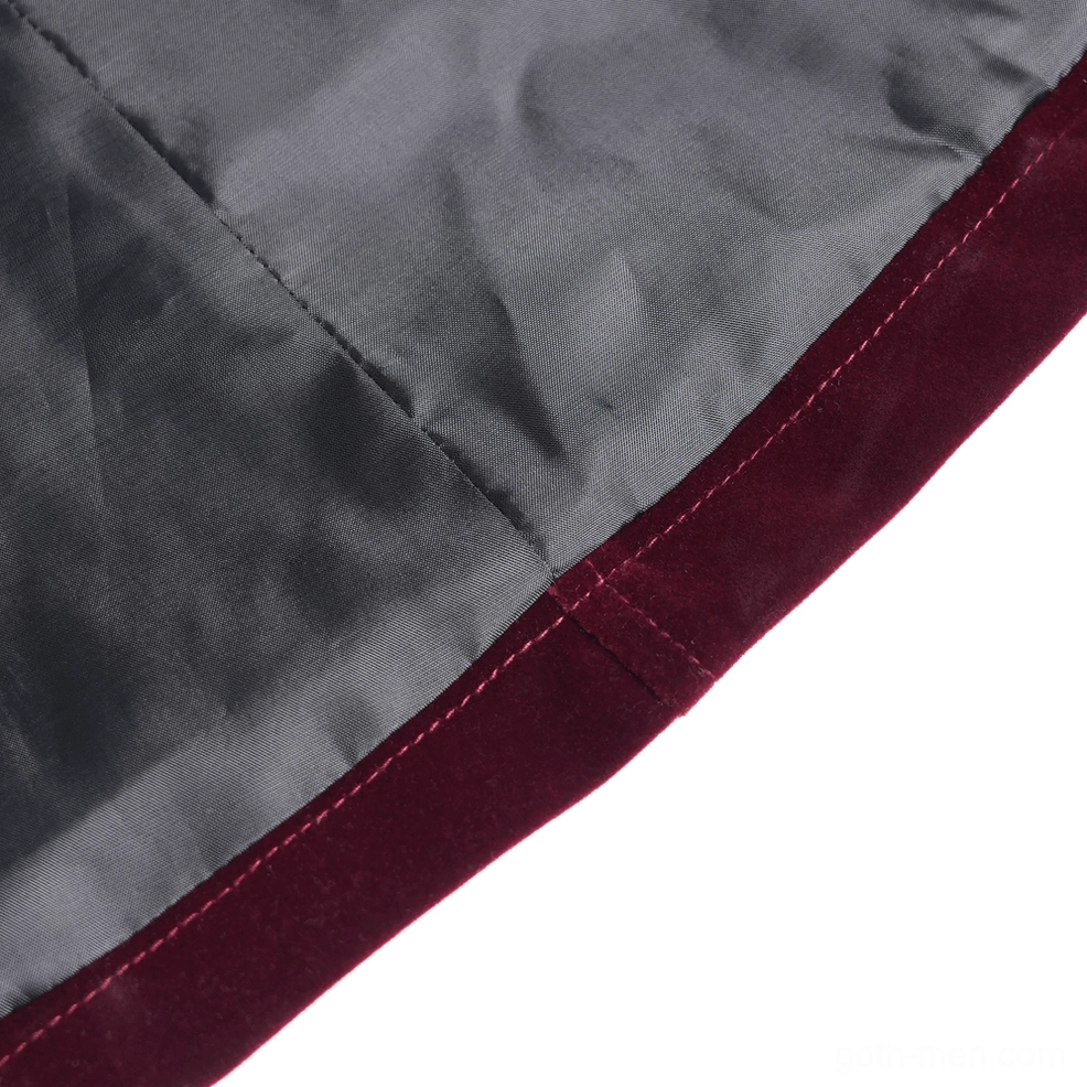 Burgundy gothic velvet tailcoat on model displaying movement in split tail and dramatic Victorian silhouette