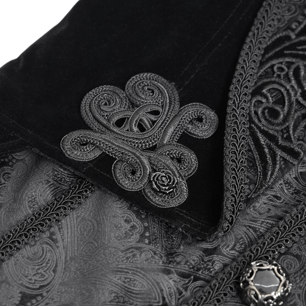 Intricate scroll embroidery and ornamental velvet detail on Gothic Victorian tailcoat, highlighting patterned underlayer and decorative metalwork
