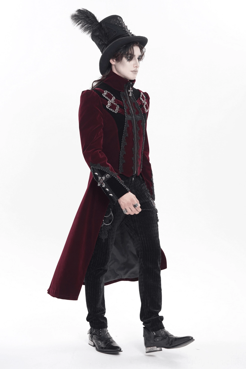 Close-up detail of burgundy velvet tailcoat showing high stand collar, lace trim pattern, and front closure area