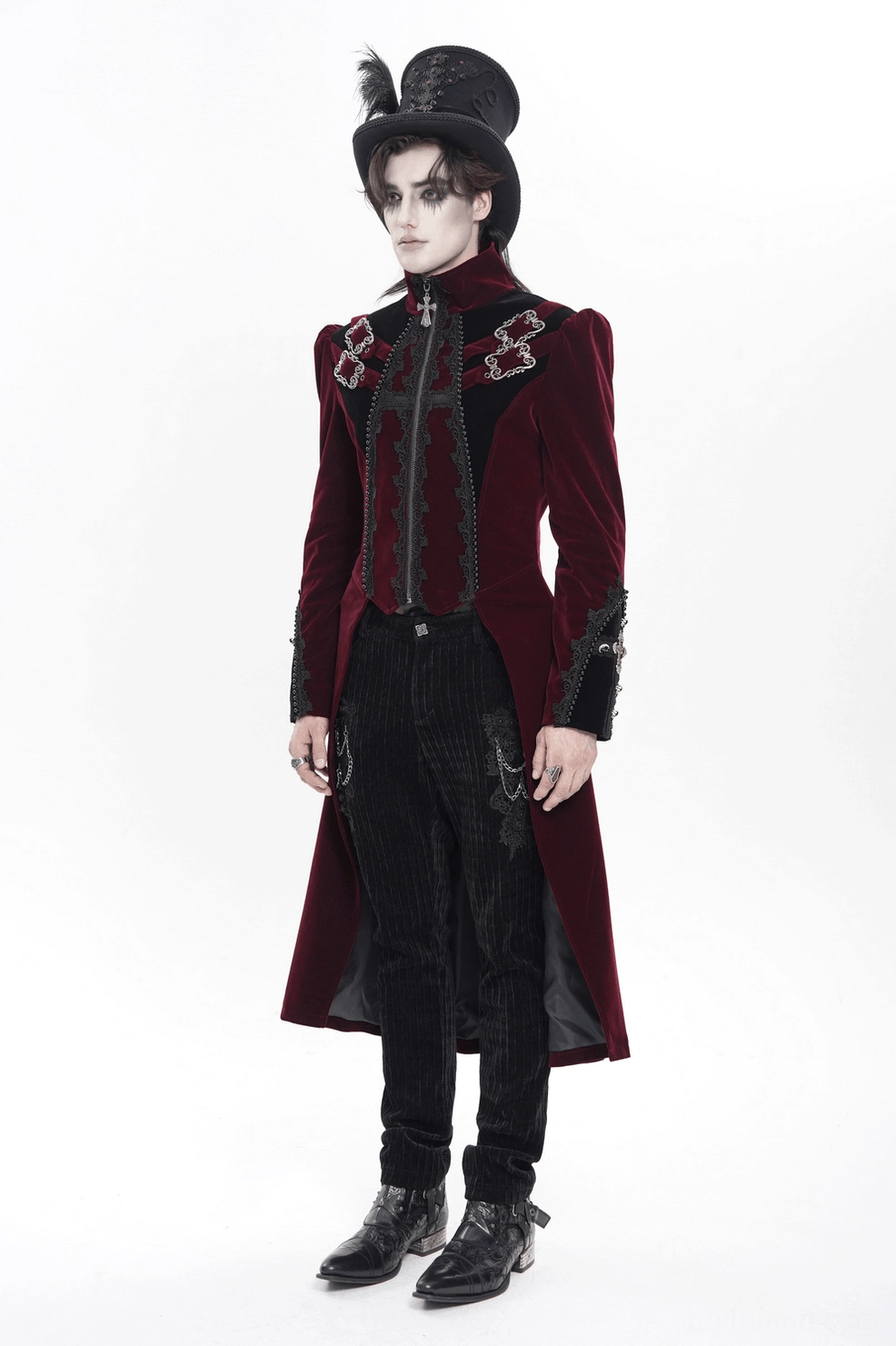 Three-quarter view of burgundy velvet gothic tailcoat showing fitted cut, ornate lace, and overall architectural silhouette