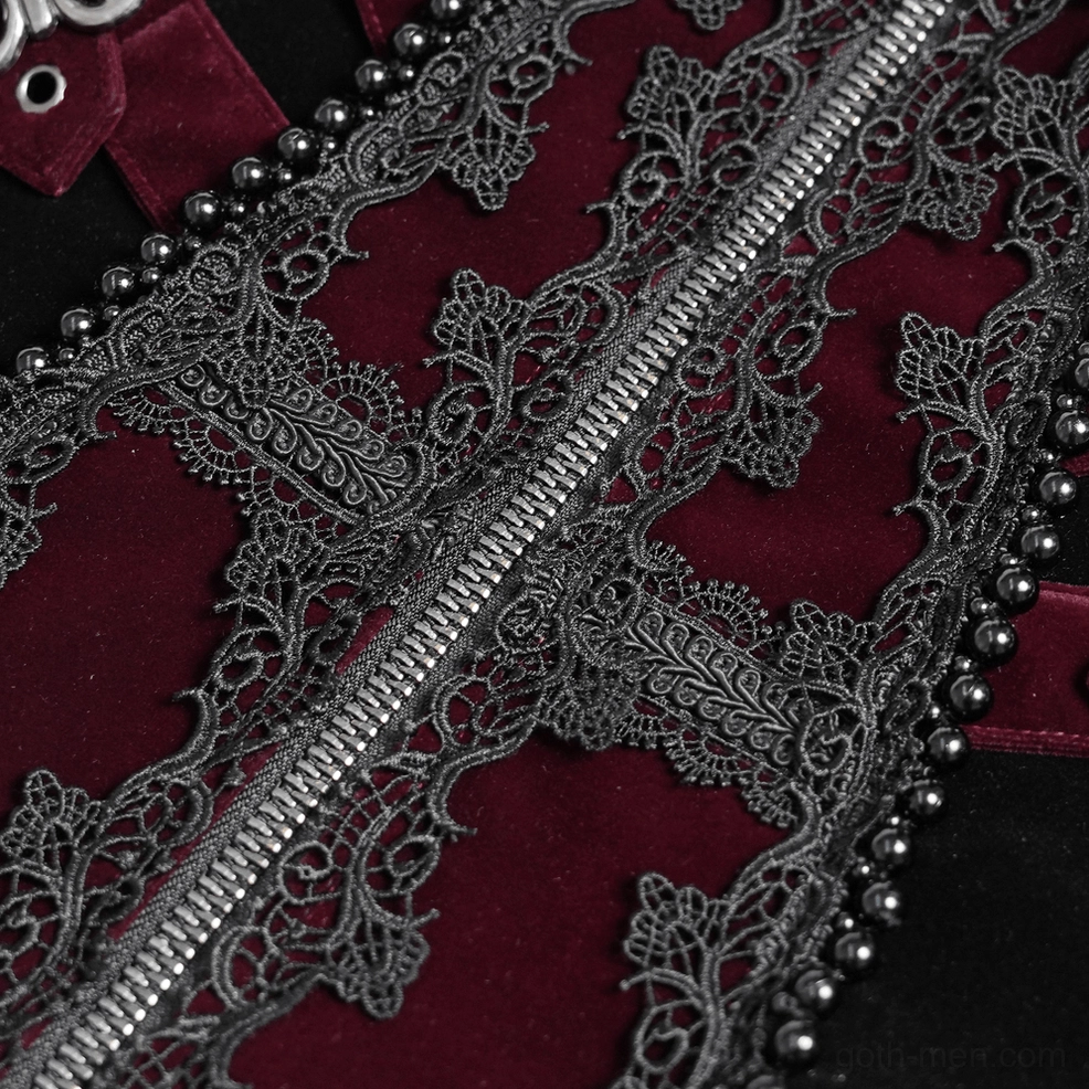 Detailed close-up of silver metal zipper, filigree lace trim pattern, and burgundy velvet fabric texture on tailcoat