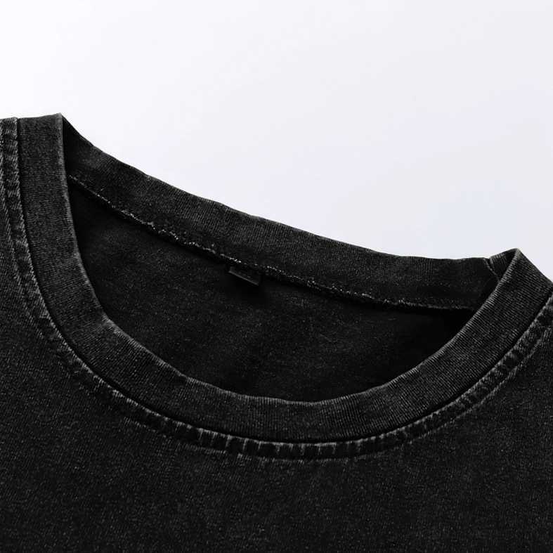 Top-down close-up of crew neckline on black washed cotton tank