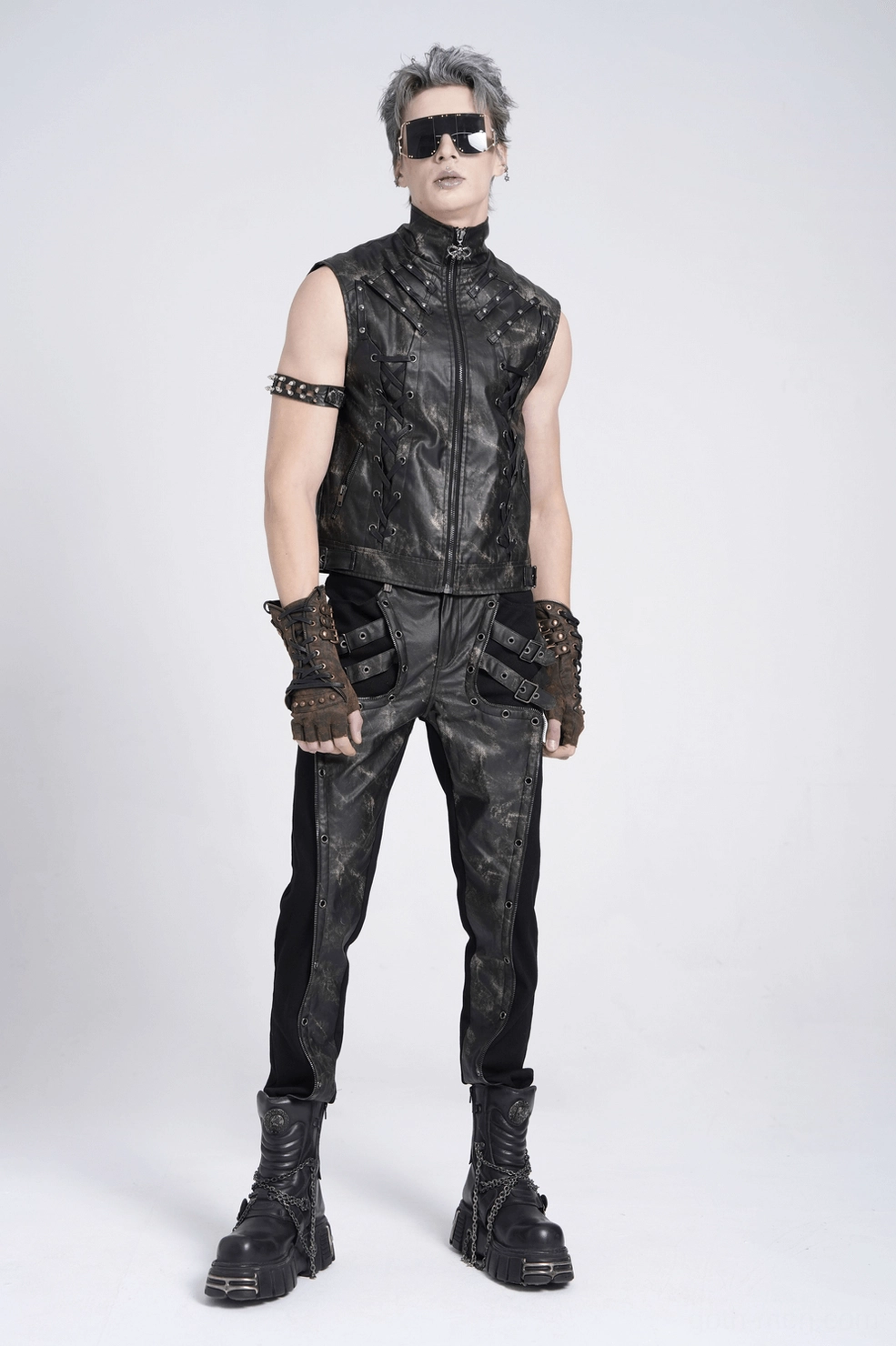 Gothic techwear pants distressed section closeup highlighting aged leather panel craftsmanship