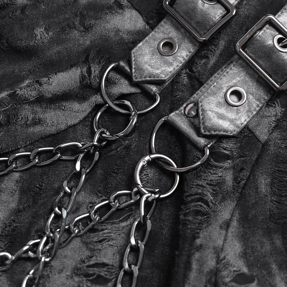 Close-up of distressed black fabric texture with metal chain and leather hardware buckle fasteners
