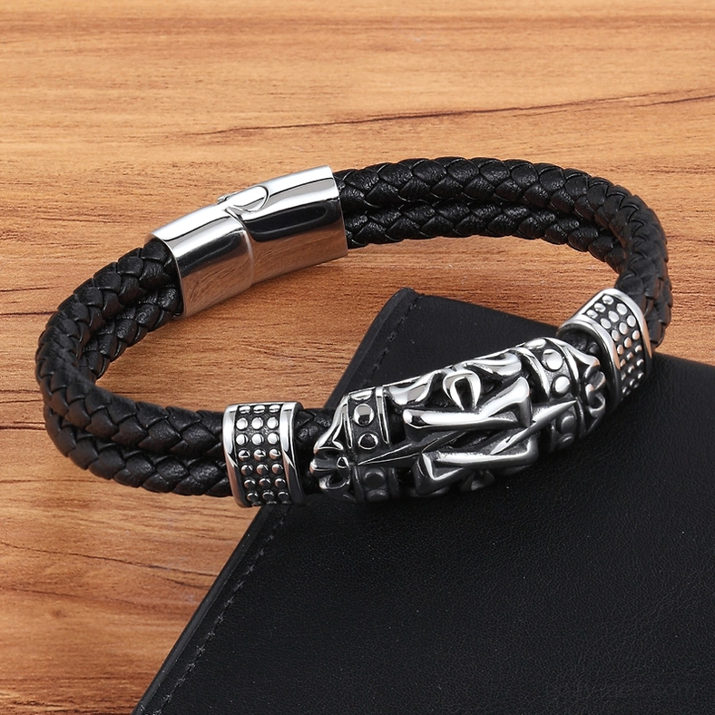 Vintage gothic totem leather bracelet top-down flat lay view with leather notebook on wooden table, showcasing magnetic clasp mechanism