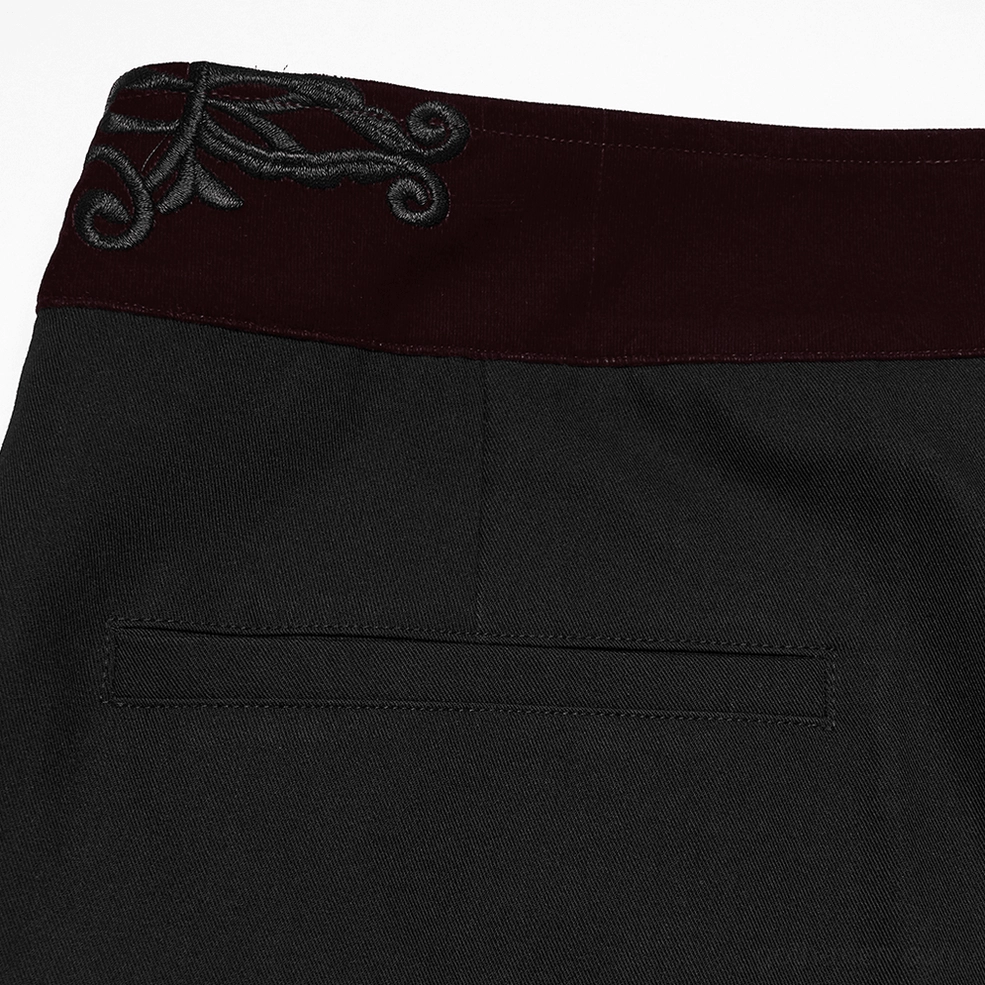 Back pocket detail of black gothic trousers showing tailored construction and twill fabric