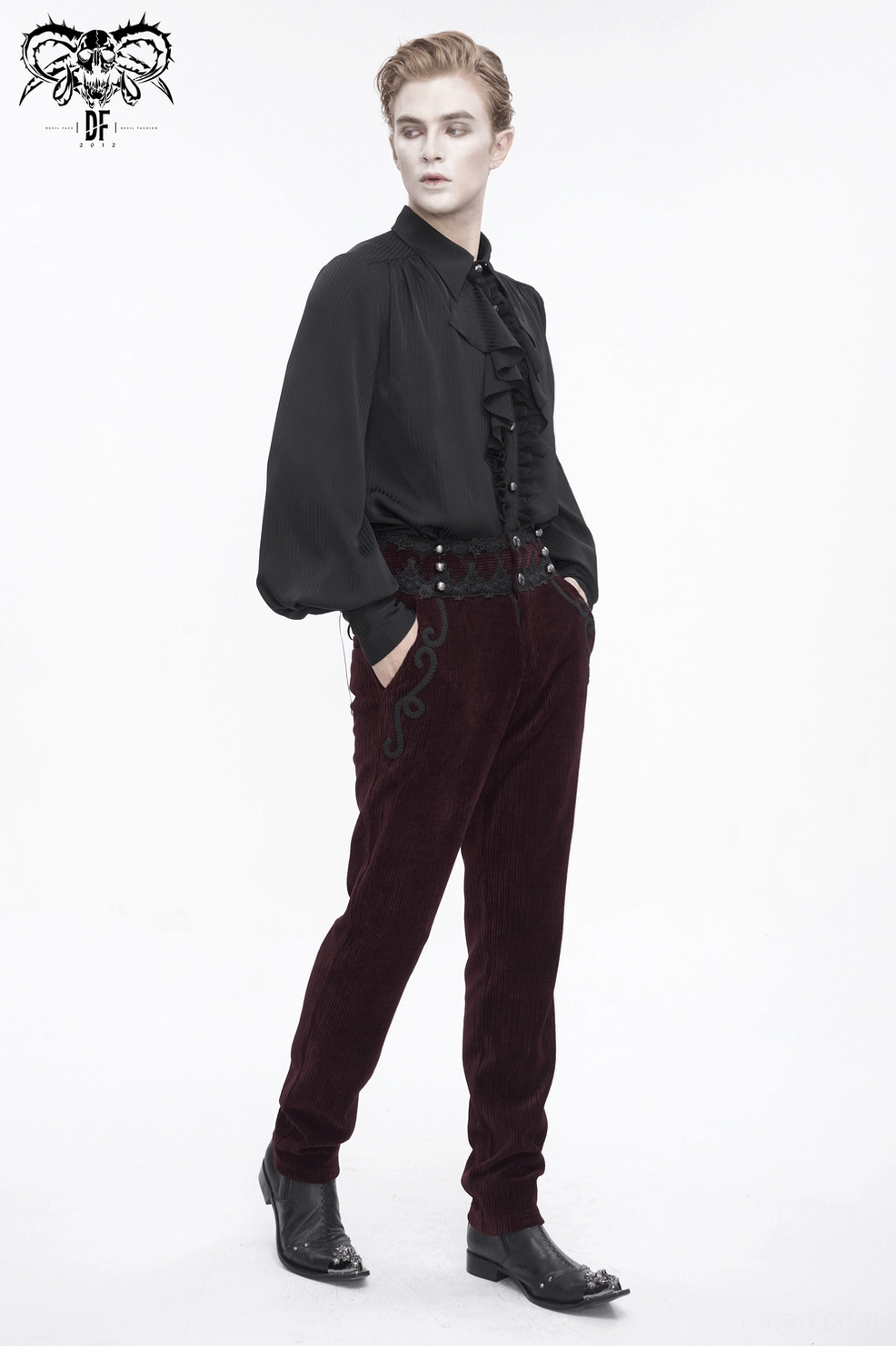 Side seam detail of wine red corduroy gothic trousers showing lace trim integration and scroll embroidery pattern