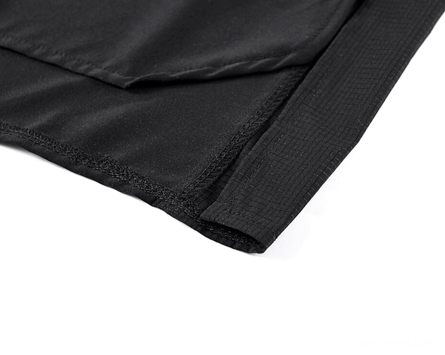 High-low split hem and textured side panel contrast fabric on oversized black gothic utility shirt