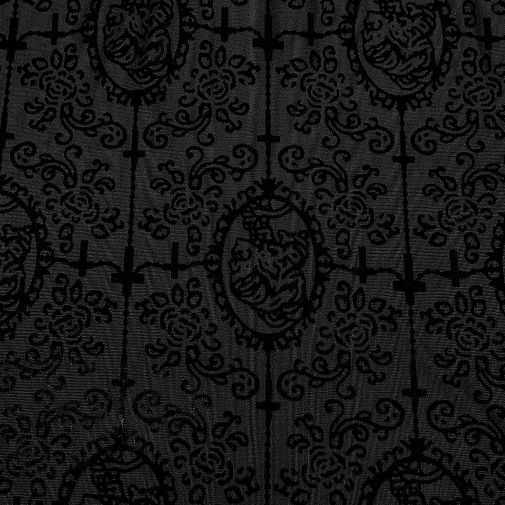 Black velvet gothic top fabric texture close-up showing vintage cross and cameo jacquard pattern