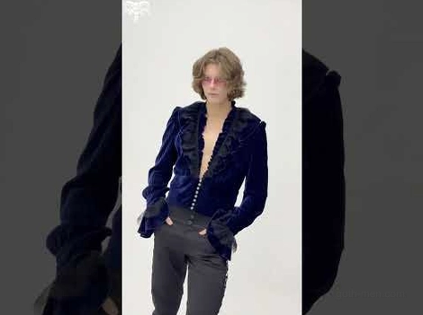 Medium front shot of midnight navy crushed velvet ruffled gothic shirt on male model against dark background