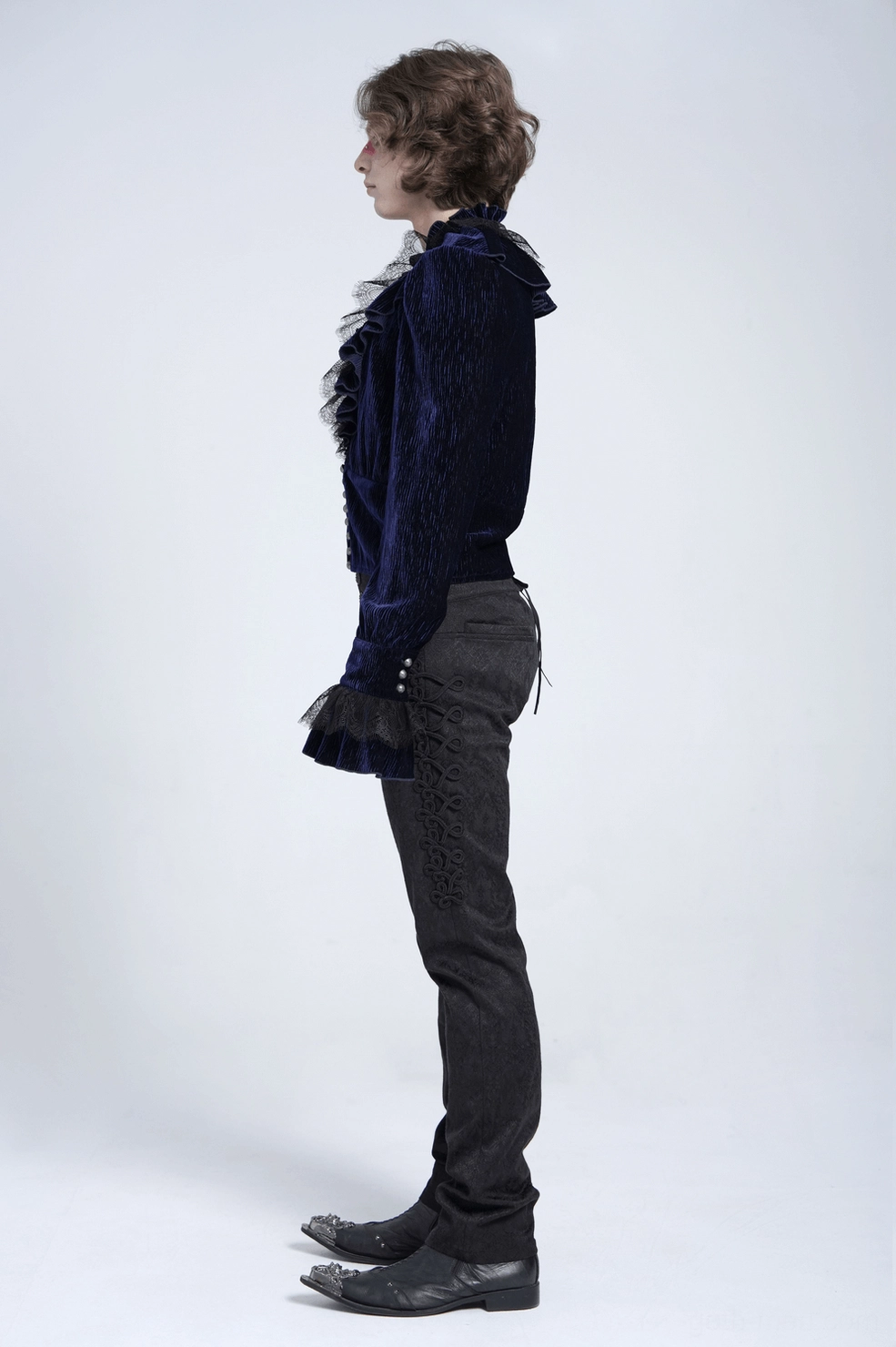 Side profile of midnight navy crushed velvet ruffled gothic shirt highlighting fitted cropped cut and sleeve detail