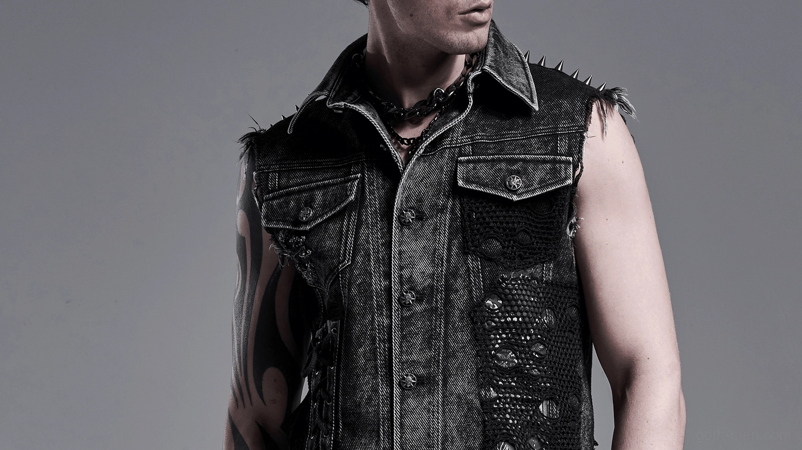 Gothic denim vest collar and shoulder rivet detail - seven-star ghost buttons and metal hardware close-up