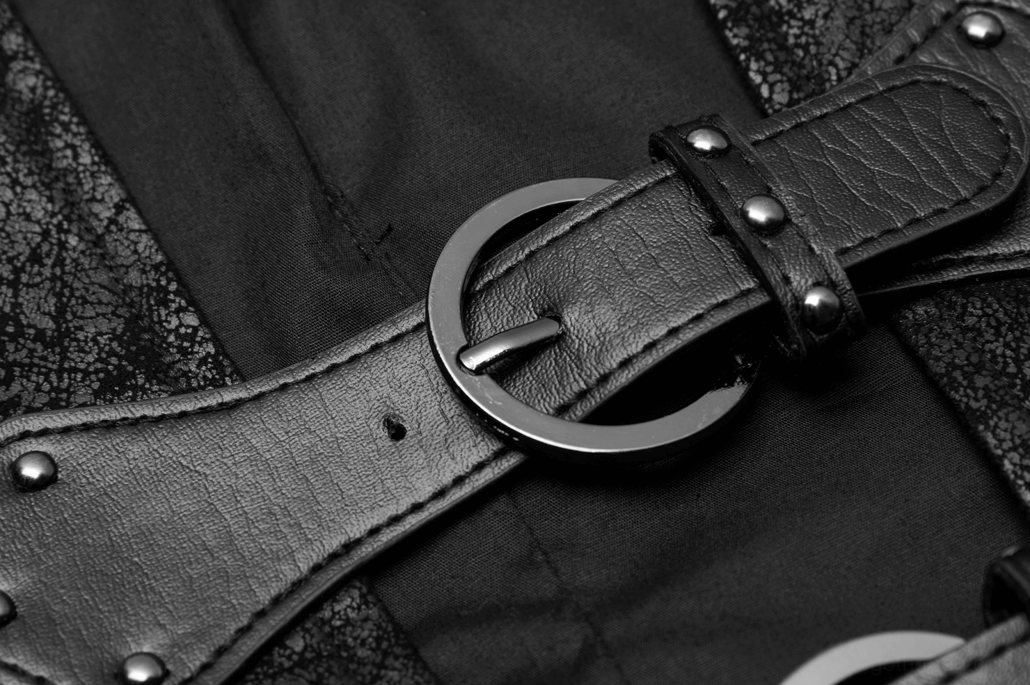 Metal round buckle hardware on black distressed leather gothic vest strap