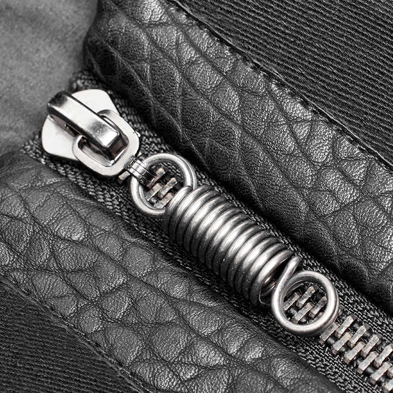 Close-up of heavy-duty metal zipper hardware on gothic chest protector vest