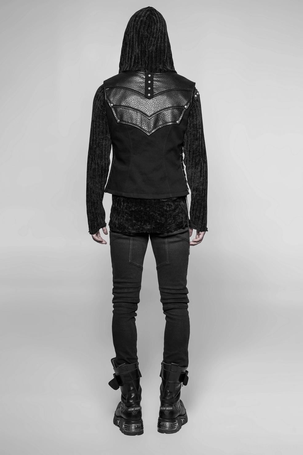 Gothic armor vest detail view of metal rivet studs and faux leather chevron construction
