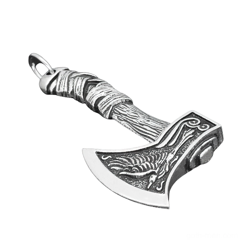 Antique silver gothic Viking axe pendant with intricate raven engraving and textured wrapped handle, shown at left oblique angle