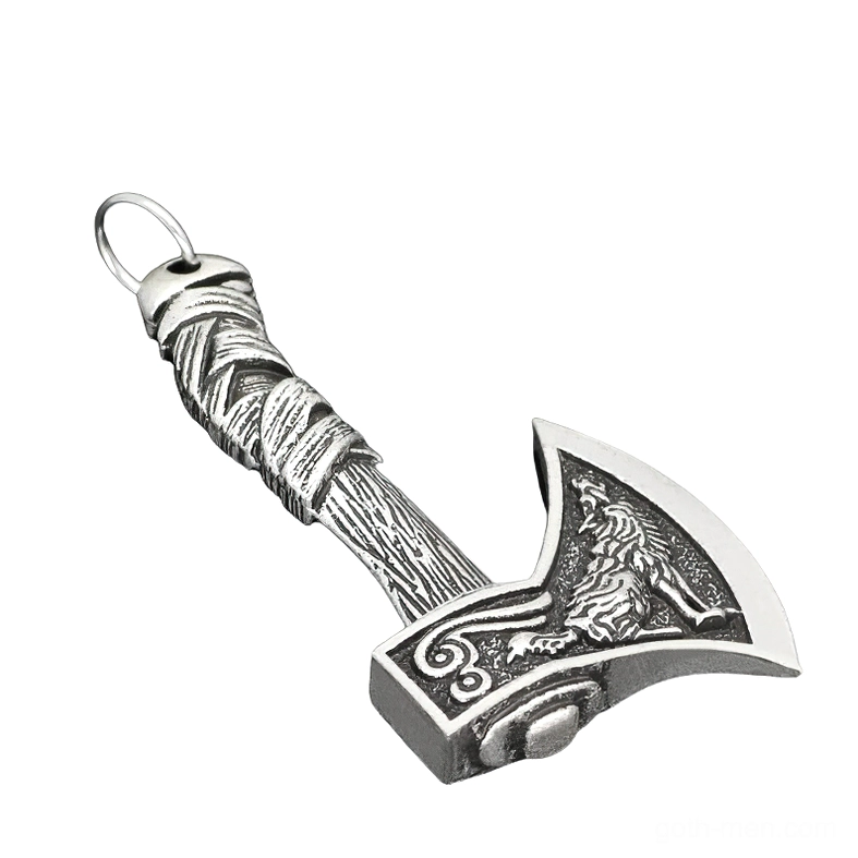 Antique silver Viking axe pendant with carved wolf engraving and textured wrapped handle, left oblique view